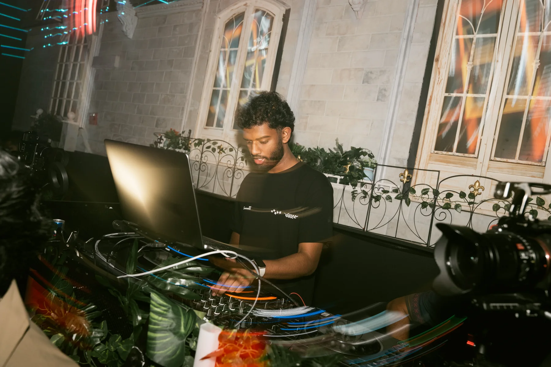 DJ Clickz performing behind the decks